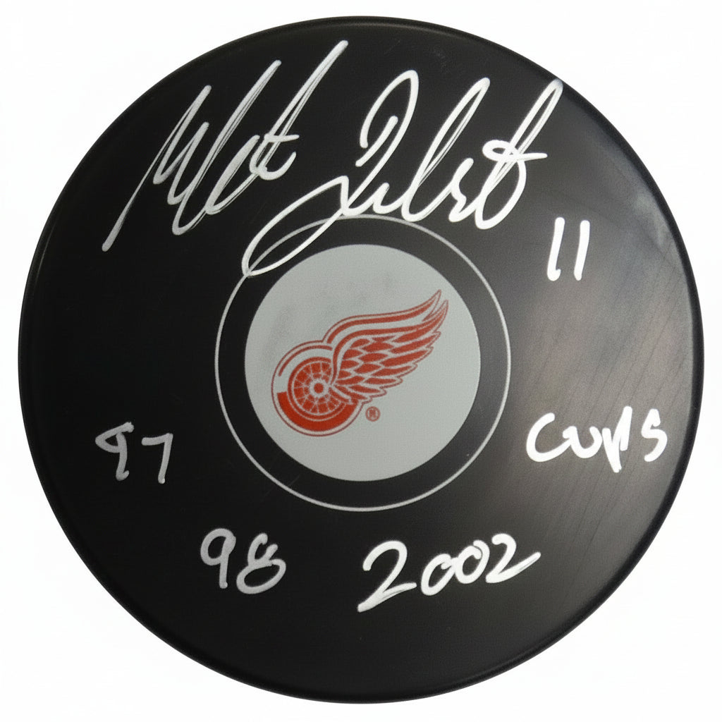 Mathieu Dandenault, Three-Time Stanley Cup Champion, Autographed Puck With Beckett Authentication